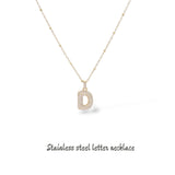 Collana iniziale lettera bombata in acciaio inossidabile colore oro e strass