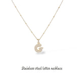 Collana iniziale lettera bombata in acciaio inossidabile colore oro e strass