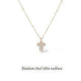 Collana iniziale lettera bombata in acciaio inossidabile colore oro e strass