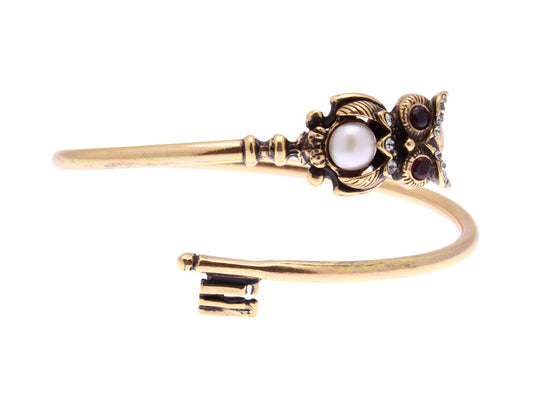 Bracciale rigido Alcozer chiave piegata con gufo